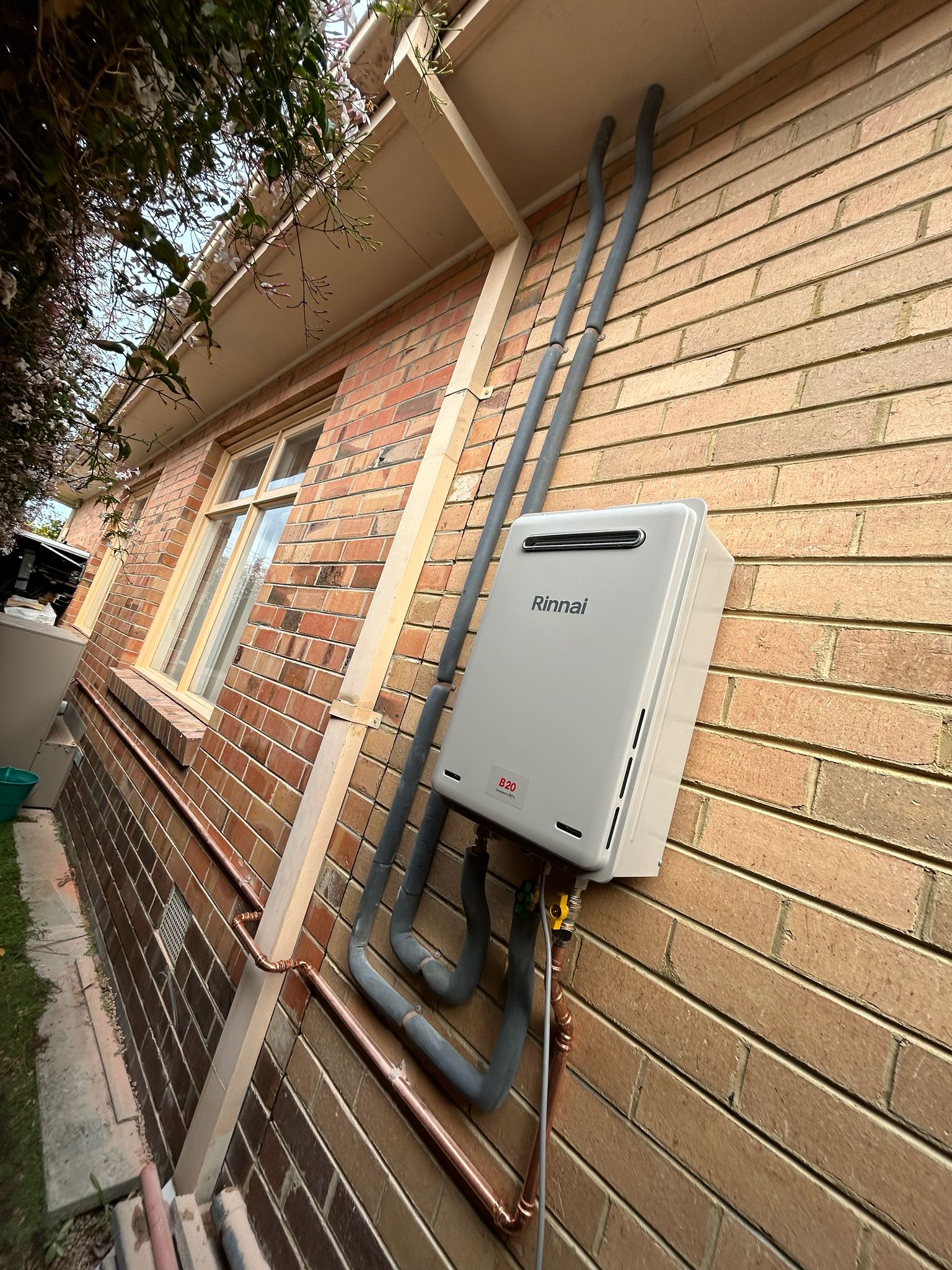 Rinnai continuous flow hot water system installed on brick wall Malvern Melbourne